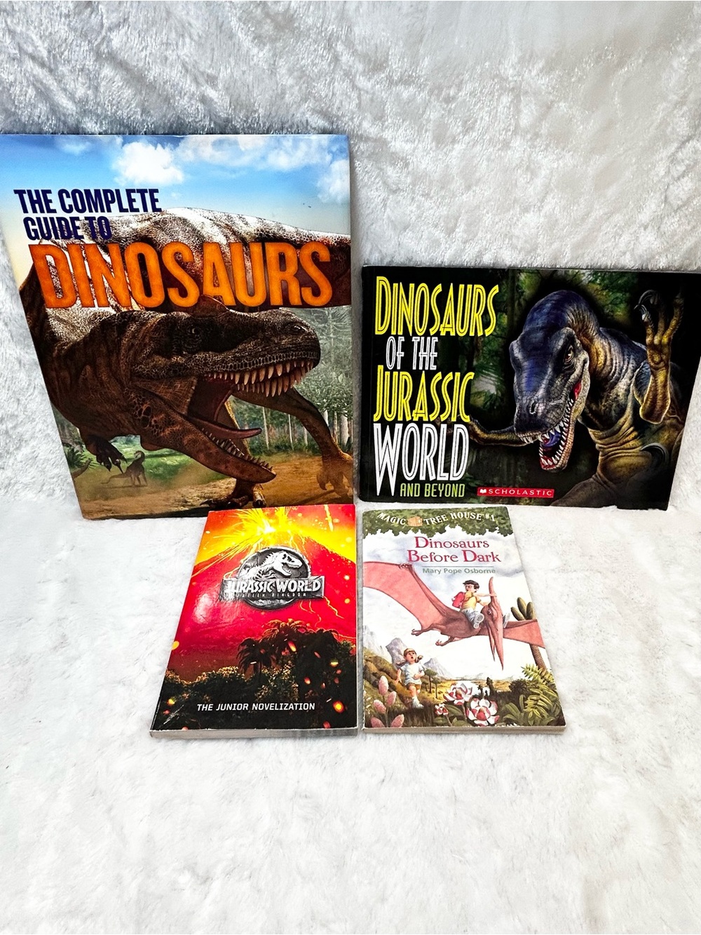 LOT OF 4 CHILDREN'S BOOKS ABOUT DINOSAURS JURASSIC WORLD